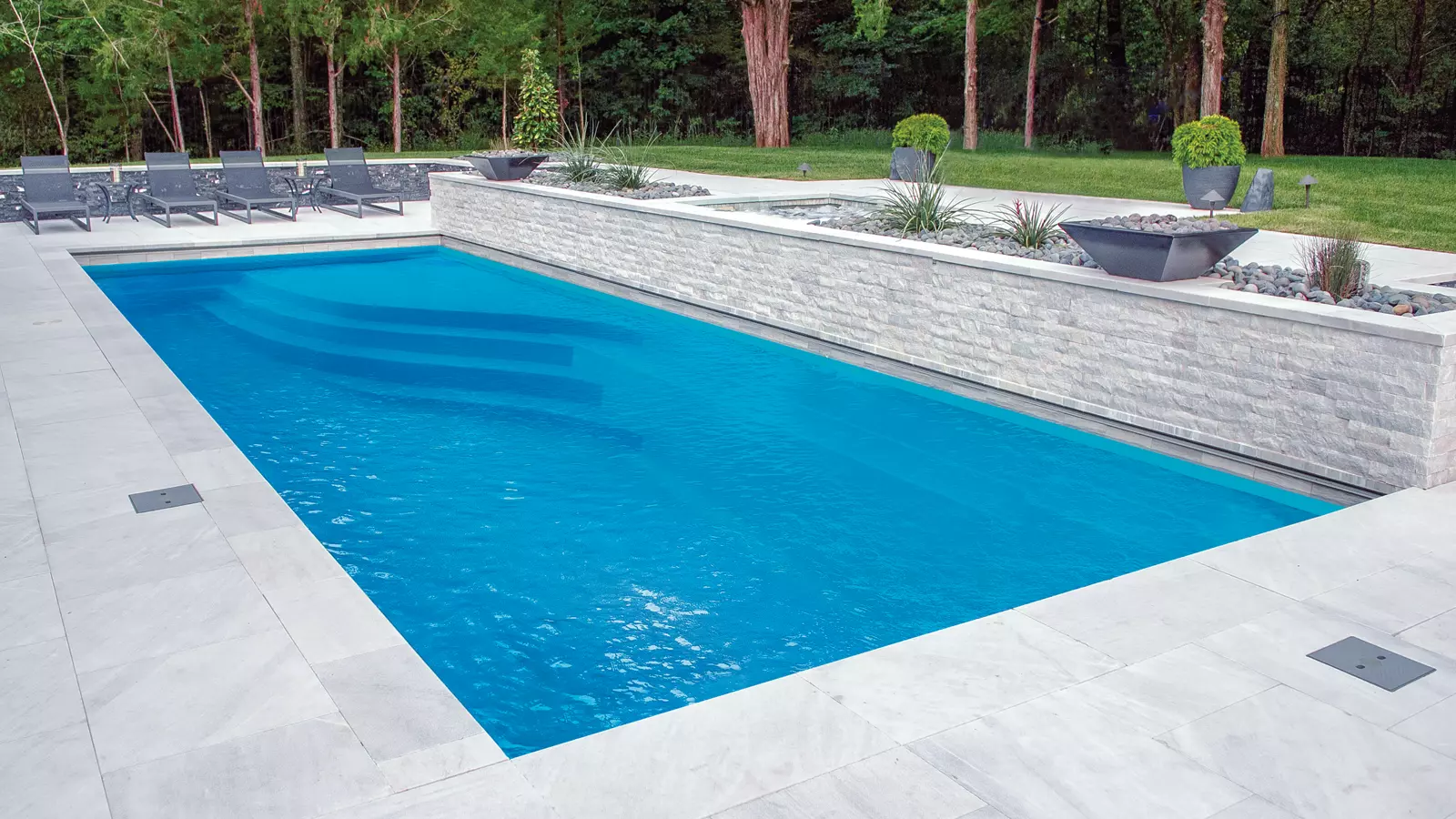 Leisure-Pools-Pinnacle-Fiberglass-Pool-Model-Hero The Wave™, a fiberglass pool design manufactured by Leisure Pools