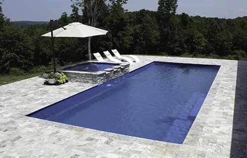 Leisure Pools The Grand rectangular fiberglass composite pool for lounging, installed by Leisure Pools Peterborough
