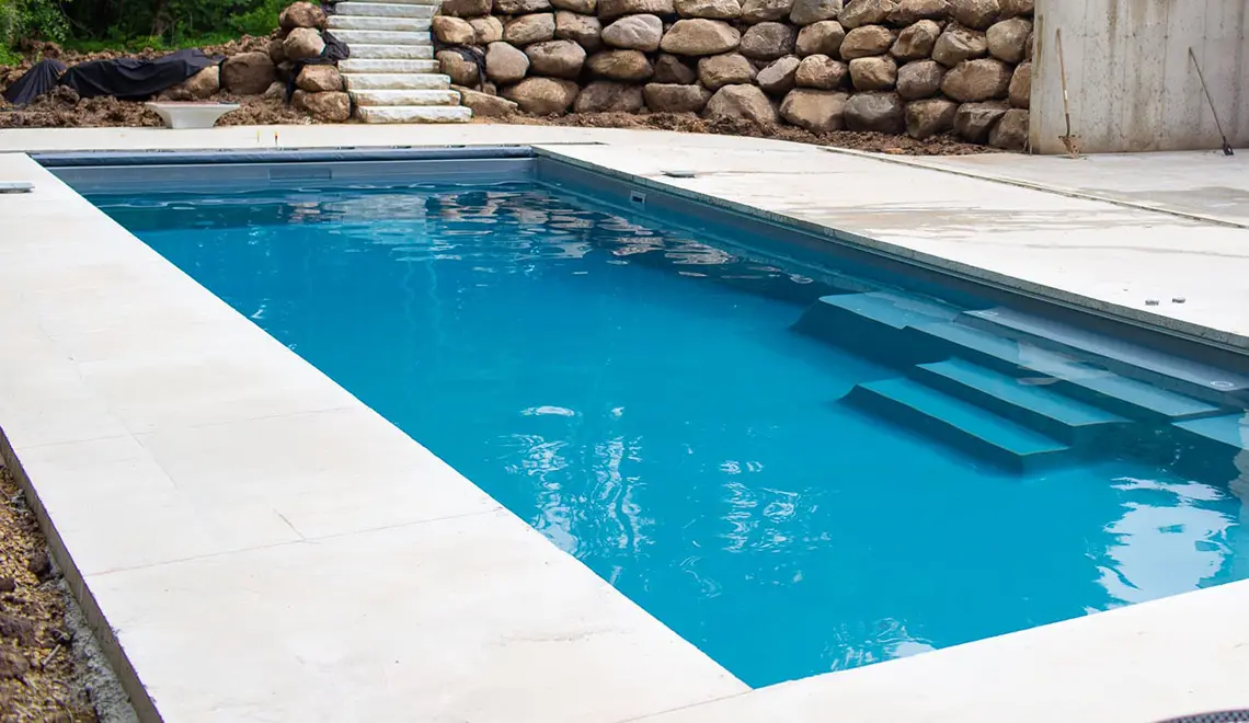 Leisure Pools The Grand rectangular fiberglass pool side view by Leisure Pools Peterborough